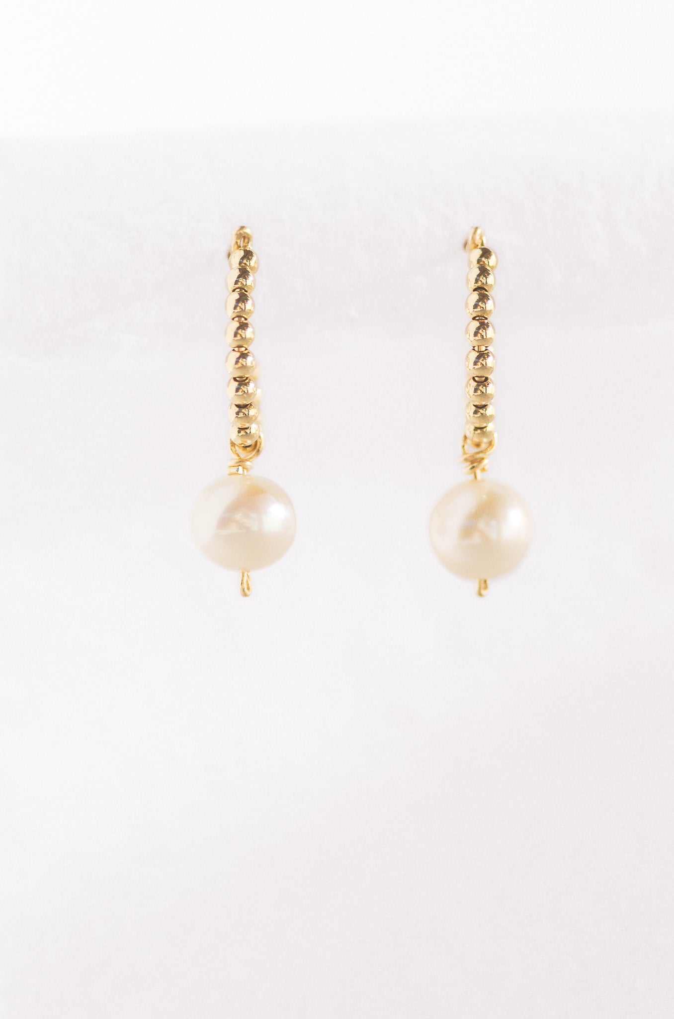 Gold beads huggie earring with pearl